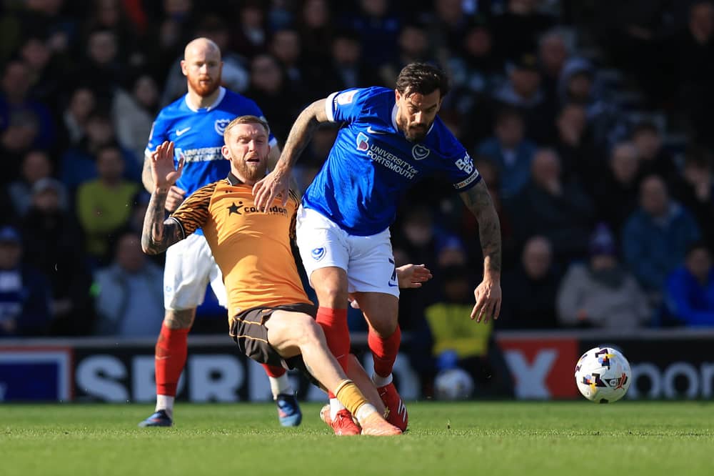 Oli McBurnie challenges Marlon Pack in Pompey's 1-0 defeat against Hull. Picture: Simon Roe/ProSportsImages