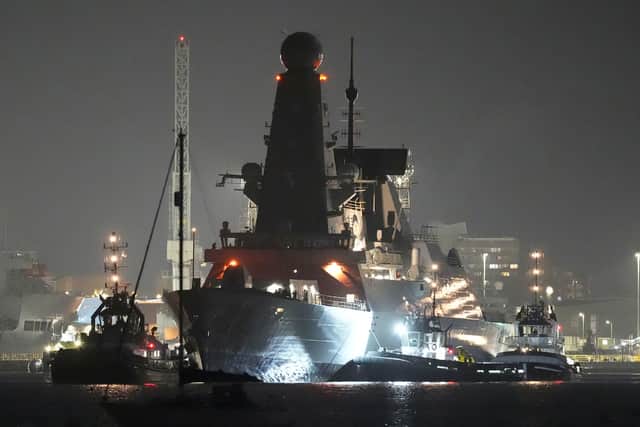 Royal Navy Type 45 destroyer HMS Dragon makes her way to the Upper Harbour Ammunition Facility (UHAF) in Portsmouth harbour, Hampshire, ahead of being deployed to protect British military personnel in Cyprus. Picture date: Tuesday March 3, 2026.