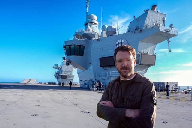 Channel 5 is launching a documentary Warship: Life on the Frontline, which will show HMS Prince of Wales preparing for one of the most dangerous legs of Operation Highmast. Picture: TV Host and former Royal Marine JJ Chalmers.