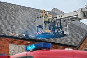 Firefighters on the aerial ladder platform.