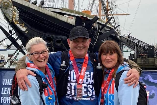 Alastair alongside his two sisters.