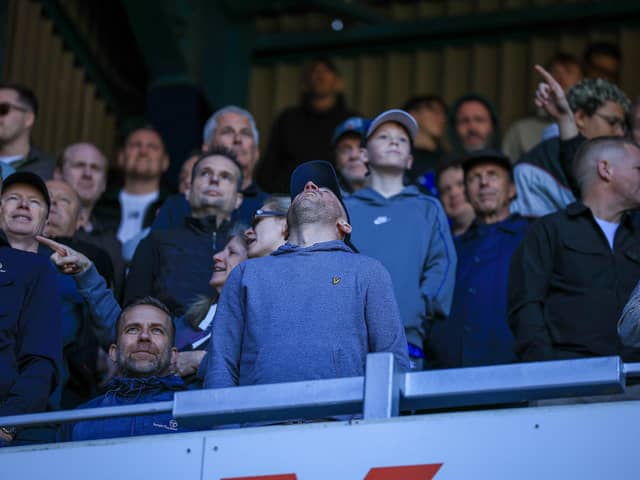 This Pompey fan looks towards the sky for inspiration after watching the Blues suffer a 6-1 hammering at QPR 