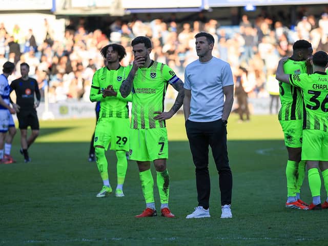 Pompey boss John Mousinho looks towards the Pompey fans who travelled to west London for Saturday's 6-1 defeat at QPR.