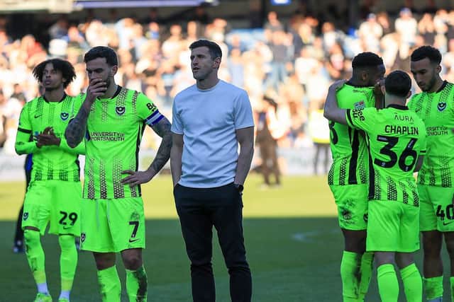 Pompey boss John Mousinho and his players after the 6-1 defeat at QPR. Picture: Chris Foxwell