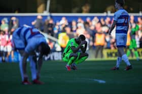 Pompey midfielder Ebou Adams at the final whistle at Loftus Road