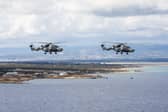 Iran is considering whether UK bases are ‘legitimate targets’ for Iranian ballistic missile strikes. Pictured: Royal Navy 815 Naval Air Squadron Wildcat HMA Mk2 (HMA2) helicopters, armed with Martlet lightweight multirole missiles, flying in a two-ship formation over British Forces Cyprus (BFC).