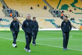 The Pompey players arrive at Carrow Road