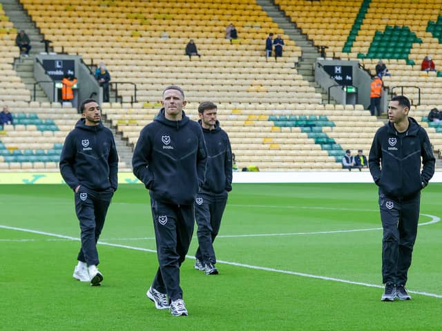 The Pompey players arrive at Carrow Road