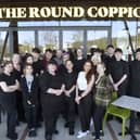 Lucy Dempsey (front, second from right), pub manager, with her team at The Round Coppice. 