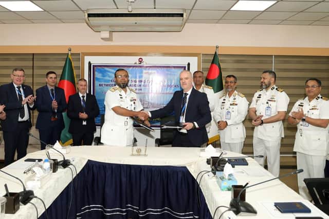 Bangladeshi Rear Admiral Md. Safiquer Rahman, assistant chief of Naval Staff (Logistics) signs off the landmark agreement with UK Docks MD, Jonathan Wilson.