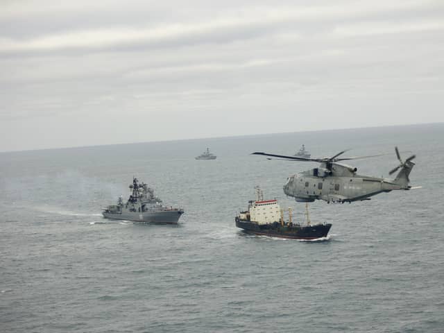 A Merlin from 814 Naval Air Squadron takes part in monitoring operations with HMS Somerset and St Albans