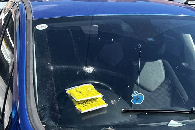 A car in Ashby Place car park, Southsea, with two tickets
