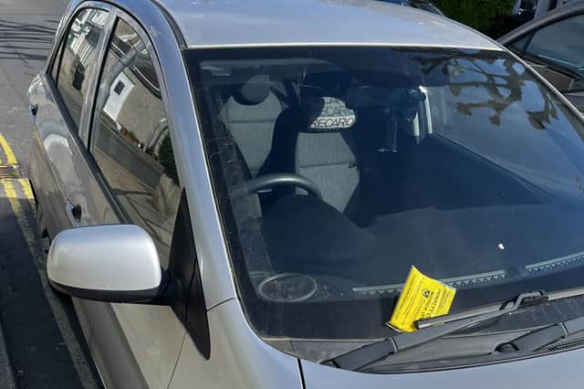 A car with a parking ticket in Chichester Road, North End, Portsmouth