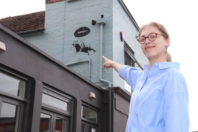 A picture of a Capybara was spray painted on The A Bar in Old Portsmouth in the early hours of the morning. 

Picture: Manager, Penelope Elliott Martin outside the A Bar in Old Portsmouth. 

Picture: Habibur Rahman