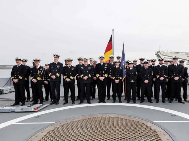 The Royal Navy has today taken command of NATO’s premier naval security force in Northern European waters during a ceremony in Portsmouth Naval Base. Pictured Commander Allied Maritime Command, Vice Admiral, Robert G Pedre, Incoming Commander for Standing NATO Maritime Group One (SNMG1), Commodore Maryla Ingham RN, Outgoing Commander for SNMG1, Rear Admiral Joaquin Ruiz Escagedo Spanish Navy, SNMG1 Staff and guests for the Change of Command Ceremony on the flight deck of FGS Sachsen at HMNB Portsmouth.