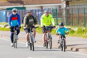 Rudy with his friends as they're about to cross the finish line. The six-year-old completed a 10k cycling challenge to raise money for Help for Heroes.