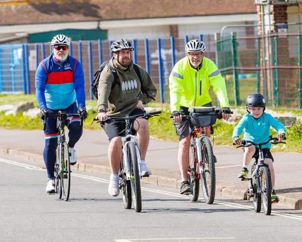 Rudy with his friends as they're about to cross the finish line. The six-year-old completed a 10k cycling challenge to raise money for Help for Heroes.