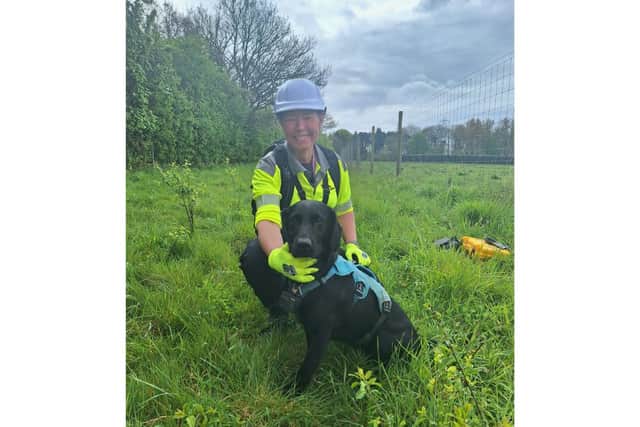 Stephanie Barrett and Tico on the hunt for water leaks in Hampshire.