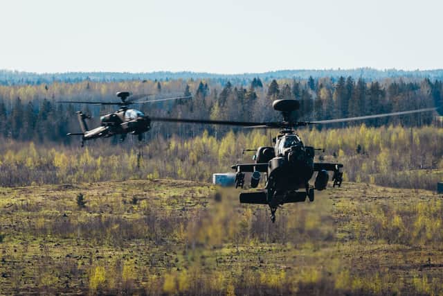 A £879m maintenance contract has secured hundreds of jobs in Gosport working on Apache and Chinook helicopters. Pictured: Two Apache AH-64E helicopters being flew low during Exercise Swift Response while they supported troops on the ground in Estonia on May 2, 2024.