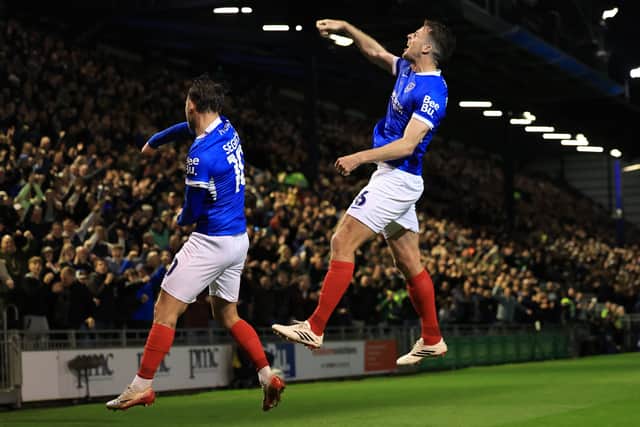 Conor Shaughnessy celebrates Pompey's opener in front of the jubilant South Stand.