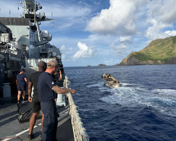 HMS Tamar sailors off the coast of Pitcairn Island. They detonated more than 3.5 tonnes of explosives