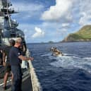 HMS Tamar sailors off the coast of Pitcairn Island. They detonated more than 3.5 tonnes of explosives