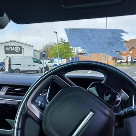 Police pulled over the driver in Portsmouth after seeing the windscreen had been covered by a sticker.
