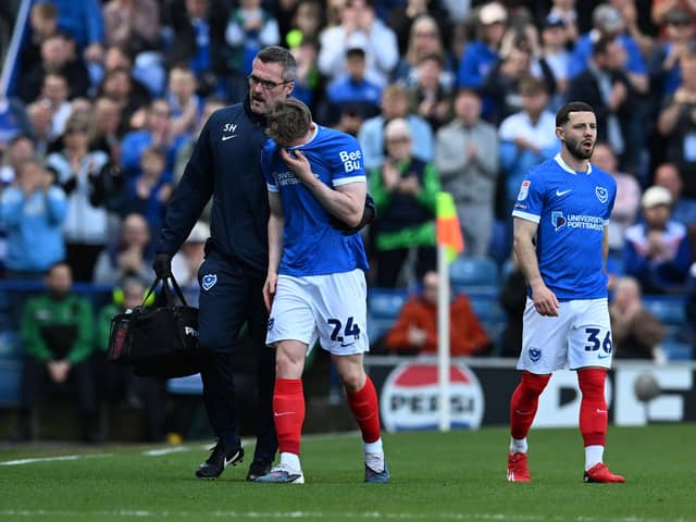 Terry Devlin leaves the pitch in tears