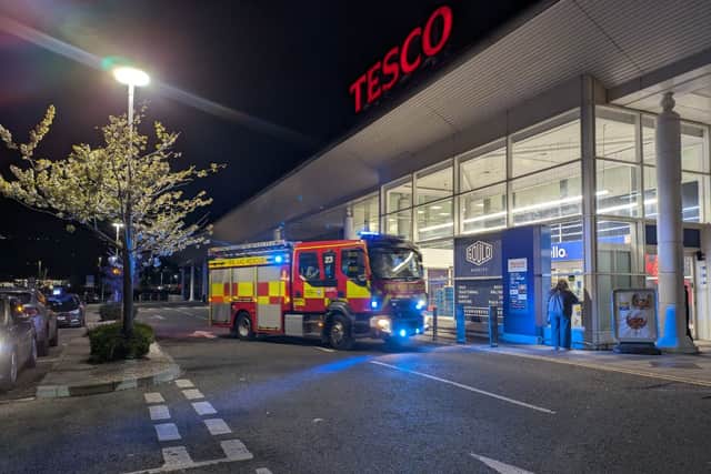 Firefighters arriving at the Tesco store in North Harbour last night.