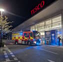 Firefighters arriving at the Tesco store in North Harbour last night.