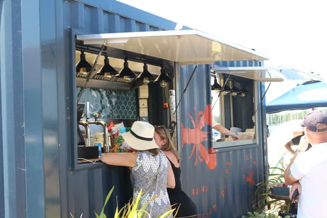 Guests ordering food and drink from the Lobster Hatch