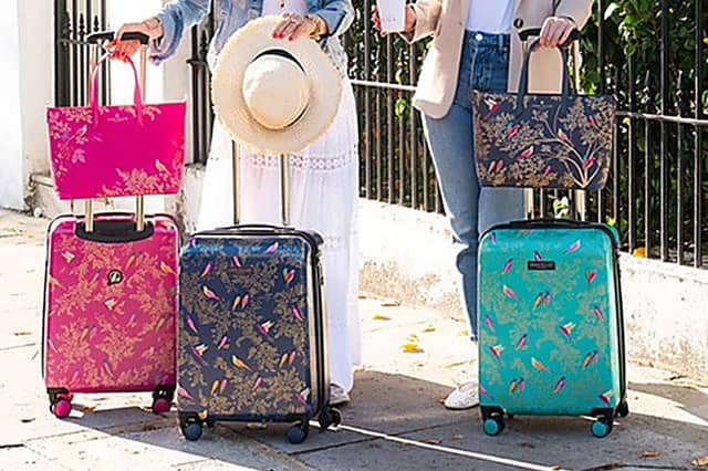 These new colourful pink, blue and green suitcases from Sara Miller London are standout luggage - and they fit within Ryanair size requirements.