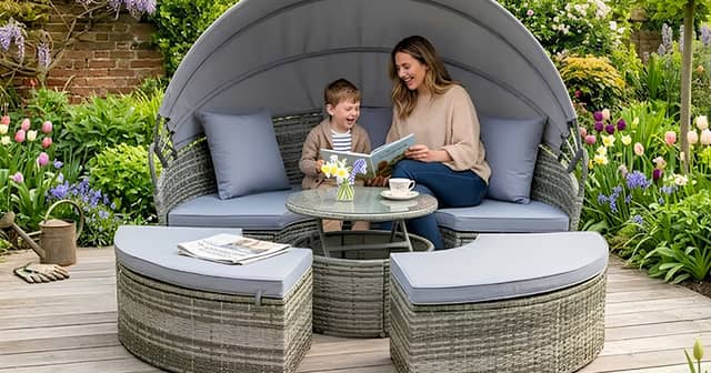 A stylish rattan garden day bed set with canopy and table creates the perfect spot for relaxing outdoors