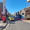 Police in Cosham High Street on April 24, 2026. A man has suffered life-threatening injuries after an attack