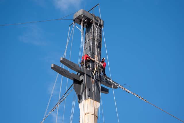 Riggers working on a mast of HMS Victory at the Portsmouth Historic Dockyard
