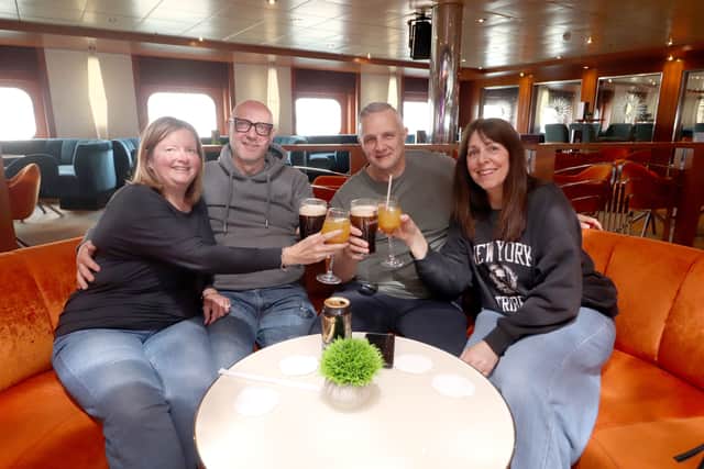 Pictured: Passengers getting settled ahead of the start of their holiday.