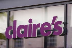 The Claire's logo above a shop doorway