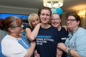 Sophie Ralph, centre, has had her head shaved in support of World Parkinson's Day.