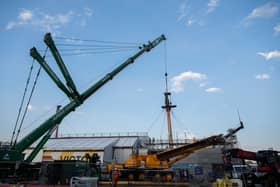 The latest phase of work has commenced at HMS Victory as part of the Big Repair project, with the remaining masts being removed by a crane. 