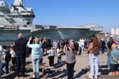  HMS Queen Elizabeth looks glorious as she returns to Portsmouth after major revamp on Monday 27th April 2026
Pictured: People at the Round Tower watching as she comes in 
