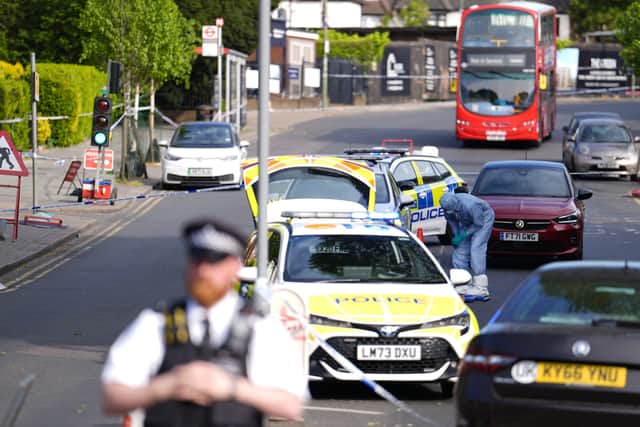 Police officers at the scene in Golders Green, north-west London, after two men - one aged in his 70s and another in his 30s - were stabbed on Wednesday morning