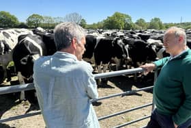 Liberal Democrats leader Sir Ed Davey (right) talks with dairy farmer Peter Caines, during a visit to Stanbridge dairy farm near Petersfield whilst on the campaign trail for the upcoming local elections. 
PA Photo. Photo credit should read: Nick Warren/PA Wire