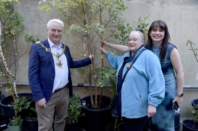 The Lord Mayor of Portsmouth Gerald Vernon-Jackson, Trish Bell from Charles Dickens Community Orchards and Portsmouth and Southsea tree wardens and Anastasia Alexandru, creative producer at Playland Artswork.