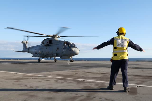 Merlin MK2 Helicopters from 820 Naval Air Squadron embark on Britain's flagship HMS Prince of Wales. The ship is currently carrying out Fleet Operational Standards and Training.