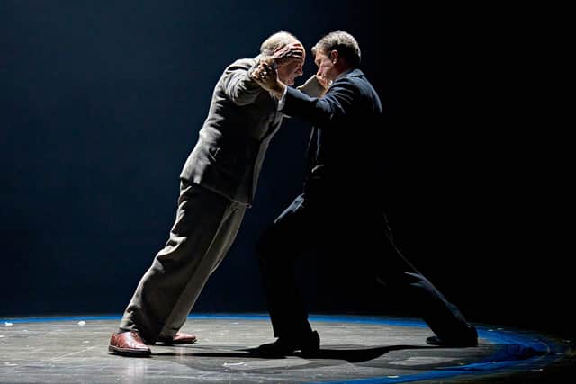 Sir Arthur Conan Doyle (David Haig) and Harry Houdini (Hadley Fraser ) wrestle with their emotions in Magic at the Chichester Festival Theatre.
