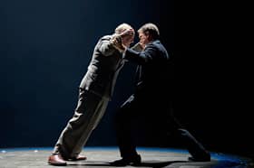 Sir Arthur Conan Doyle (David Haig) and Harry Houdini (Hadley Fraser ) wrestle with their emotions in Magic at the Chichester Festival Theatre.