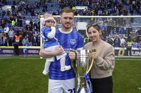 Jack Sparkes with the League One trophy he won at Pompey. Pictured with Lily (left) and his partner Abbie. Picture: Jason Brown/ProSportsImages