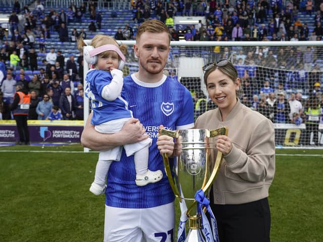Jack Sparkes with the League One trophy he won at Pompey. Pictured with Lily (left) and his partner Abbie. Picture: Jason Brown/ProSportsImages