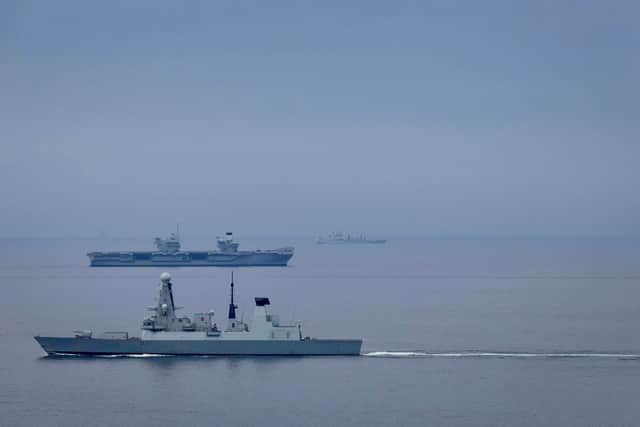 HMS Prince of Wales sailing alongside HMS Duncan as they are set to take part in Exercise Tamber Shield and Dynamic Mongoose.