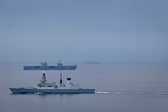 HMS Prince of Wales sailing alongside HMS Duncan as they are set to take part in Exercise Dynamic Mongoose.